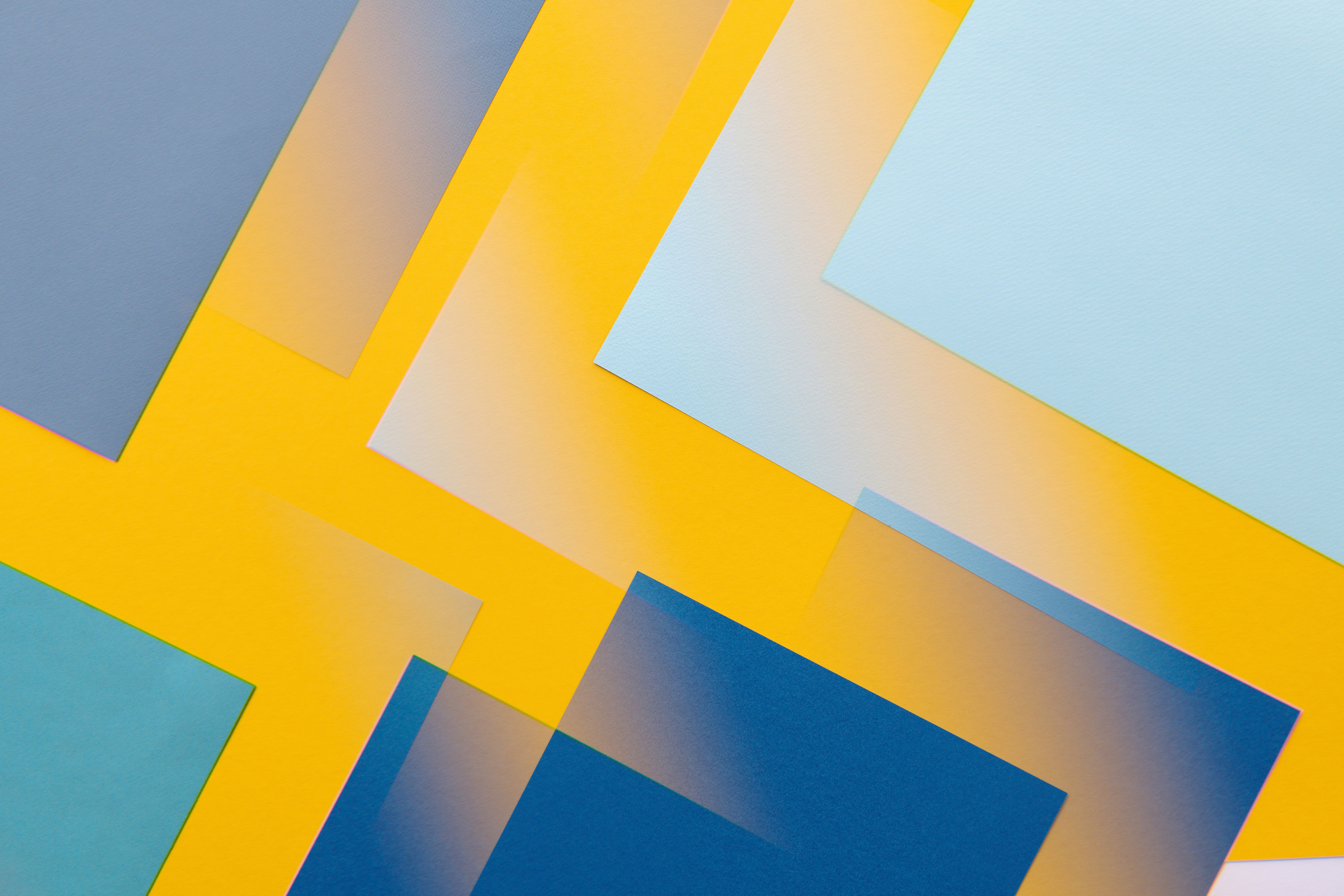 Yellow and blue abstract paper shapes for Data Privacy, Security and Ethics